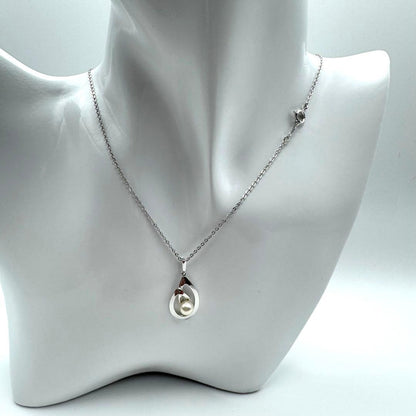 Mikimoto Akoya pearl necklace with silver teardrop pendant, silver chain, and red storage box