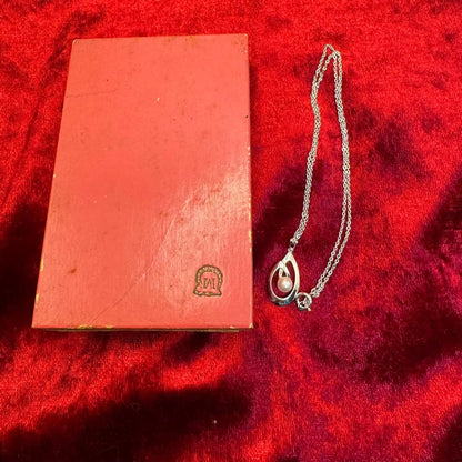 Mikimoto Akoya pearl necklace with silver teardrop pendant, silver chain, and red storage box