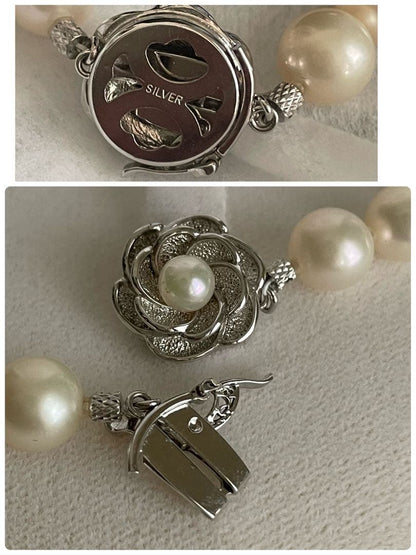 Vintage Akoya pearl necklace featuring a single 9.5 mm pearl and double lock clasp on a 44.5 cm chain