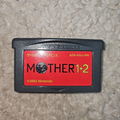 Nintendo GAMEBOY Advance handheld console with MOTHER1+2 game cartridge shown