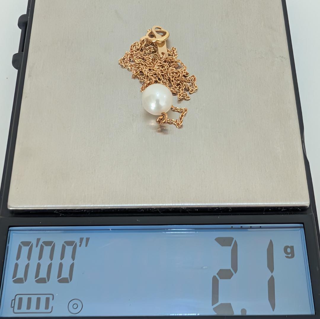 Tasaki pearl necklace featuring a 7mm pearl pendant set in 18K yellow gold with a 40 cm chain