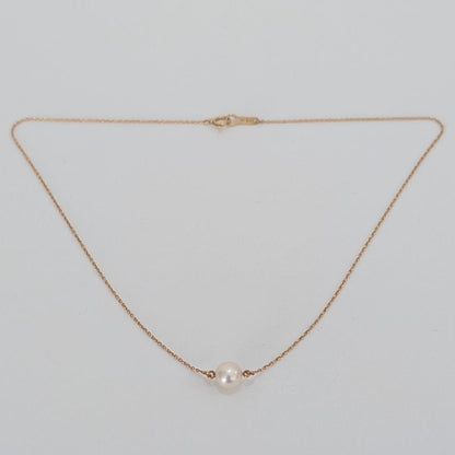 Tasaki pearl necklace featuring a 7mm pearl pendant set in 18K yellow gold with a 40 cm chain