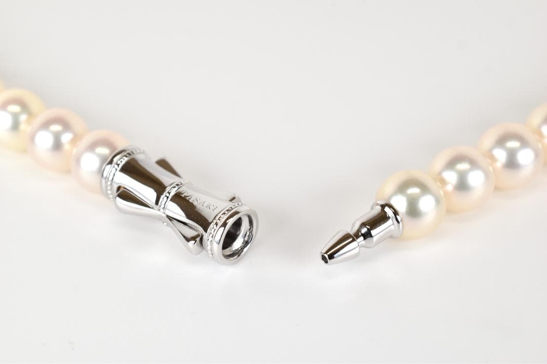 TASAKI Akoya pearl necklace with 53 pearls sized approximately 7.5 to 7.8mm and silver clasp