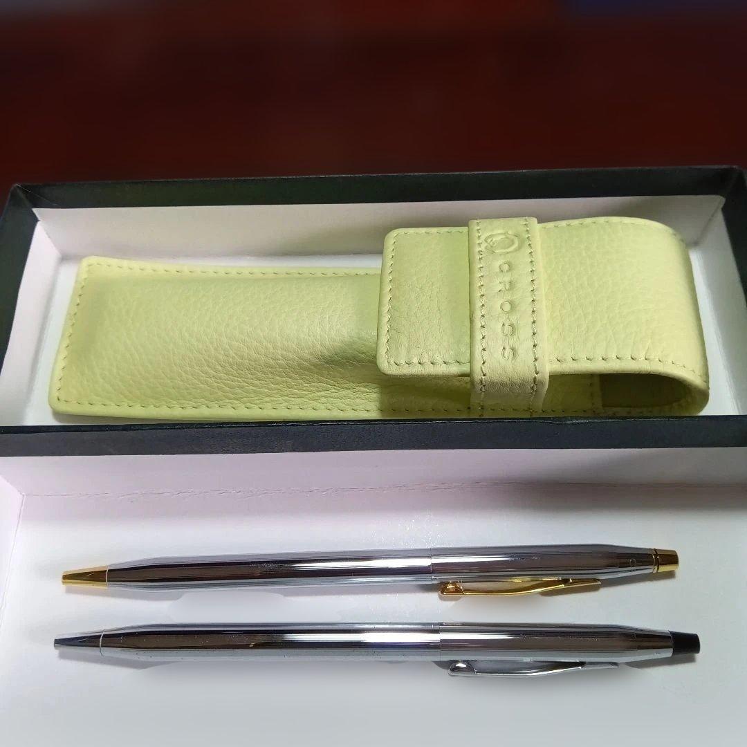 Set of 2 CROSS ballpoint pens with black and blue ink refills in a brown leather case