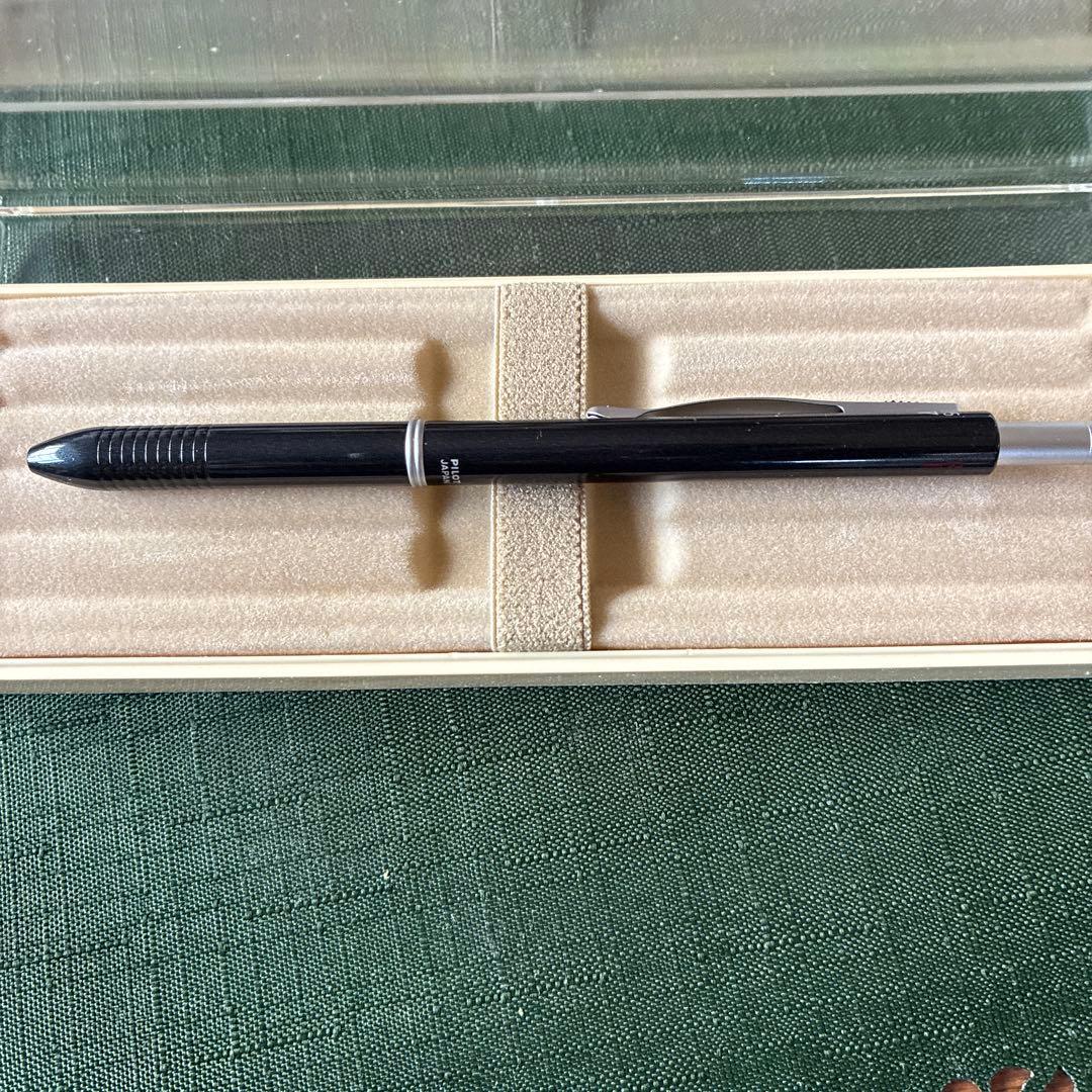 Pilot To plus One mechanical pencil and two-color ballpoint pens with visible storage wear