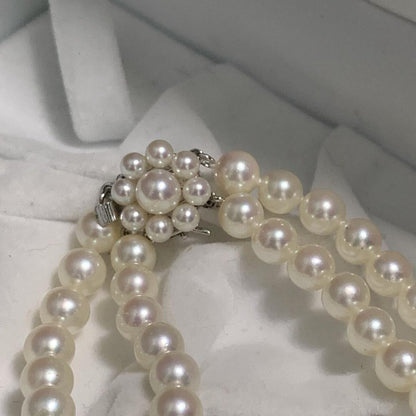 Two-strand long Tasaki Akoya pearl necklace with matching bracelet, pearls approximately 5.5-6.0mm, silver clasp