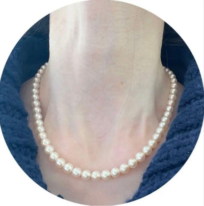 Antique Tasaki Akoya pearl necklace featuring 6.5mm round pearls on a 42cm string