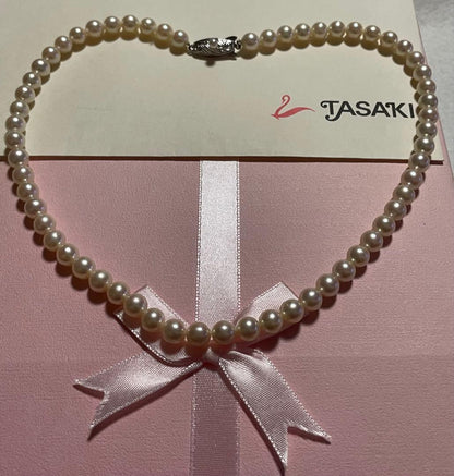 Antique Tasaki Akoya pearl necklace featuring 6.5mm round pearls on a 42cm string