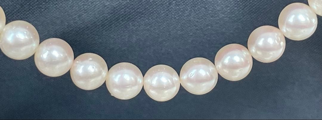 Antique Tasaki Akoya pearl necklace featuring 6.5mm round pearls on a 42cm string