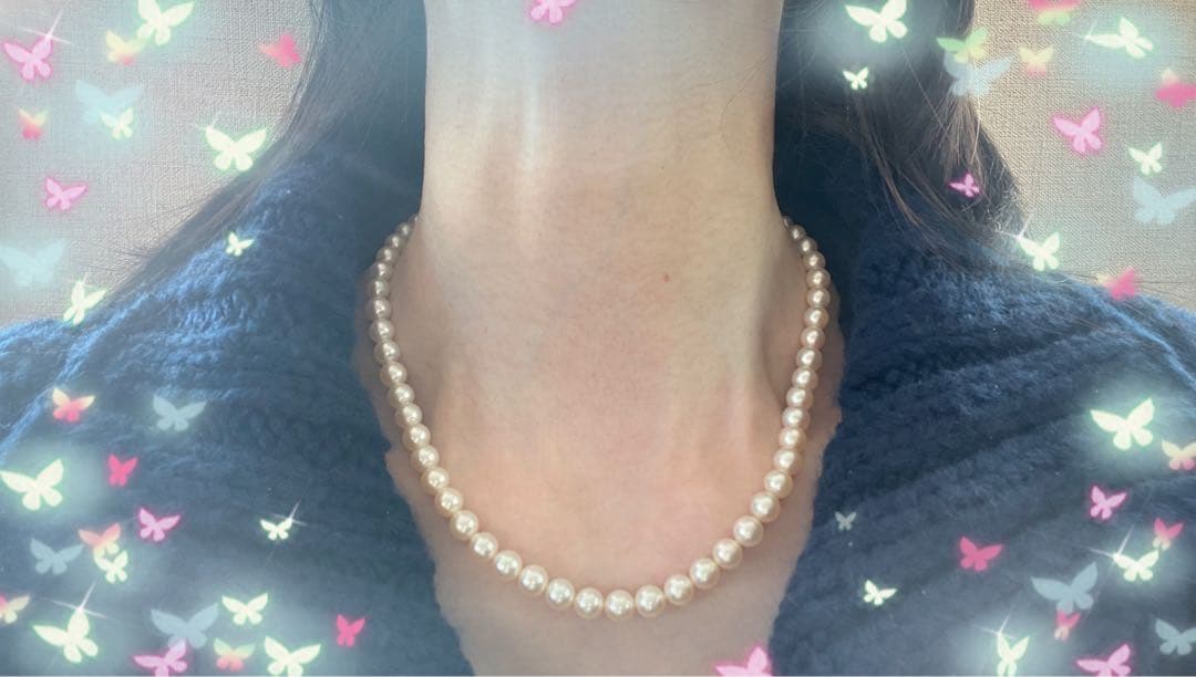 Antique Tasaki Akoya pearl necklace featuring 6.5mm round pearls on a 42cm string