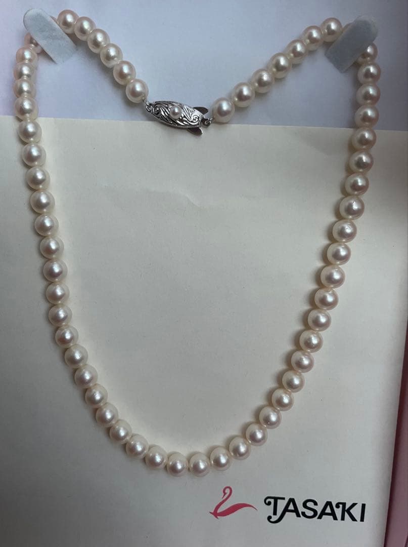 Antique Tasaki Akoya pearl necklace featuring 6.5mm round pearls on a 42cm string