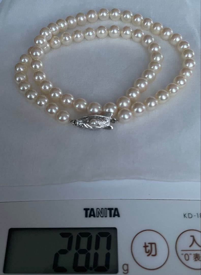 Antique Tasaki Akoya pearl necklace featuring 6.5mm round pearls on a 42cm string