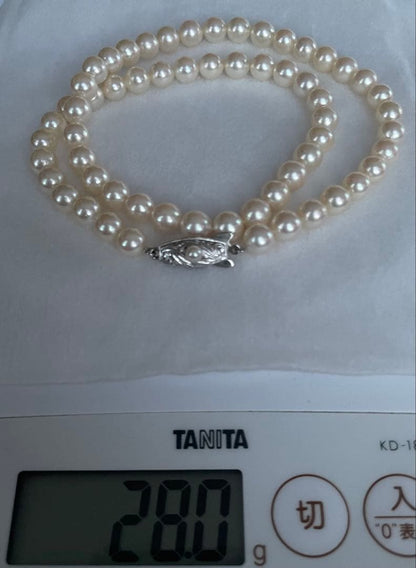 Antique Tasaki Akoya pearl necklace featuring 6.5mm round pearls on a 42cm string
