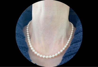 Antique Tasaki Akoya pearl necklace featuring 6.5mm round pearls on a 42cm string