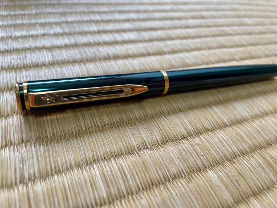 Waterman fountain pen made in France with deep green finish, classic design displayed on white background