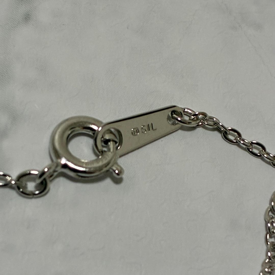 Mikimoto necklace featuring a silver white ribbon pendant with Akoya pearl on a 40 cm chain