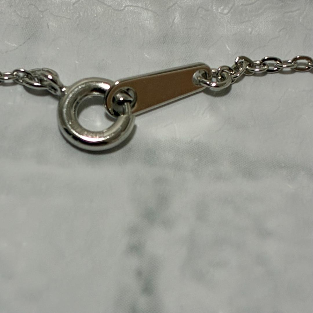 Mikimoto necklace featuring a silver white ribbon pendant with Akoya pearl on a 40 cm chain