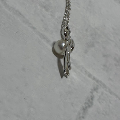 Mikimoto necklace featuring a silver white ribbon pendant with Akoya pearl on a 40 cm chain