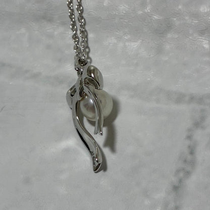 Mikimoto necklace featuring a silver white ribbon pendant with Akoya pearl on a 40 cm chain
