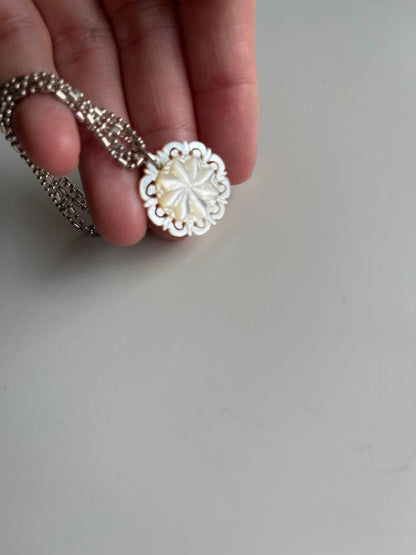 Agete shell necklace featuring natural shell pendant on delicate chain