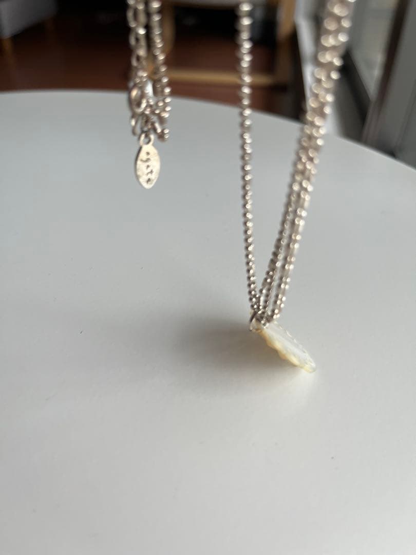 Agete shell necklace featuring natural shell pendant on delicate chain