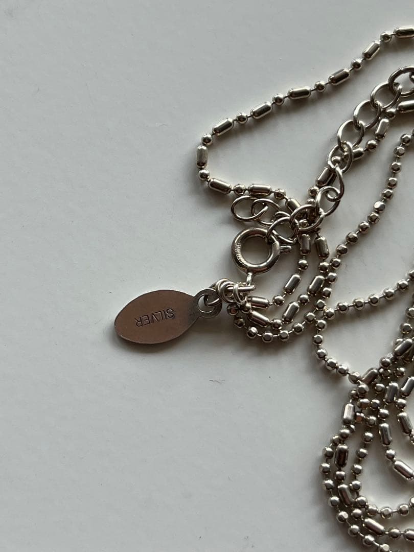 Agete shell necklace featuring natural shell pendant on delicate chain