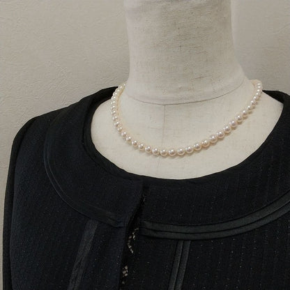 Law Akoya cultured pearl necklace with 6.5-7mm round white to cream pearls and silver clasp on a white background