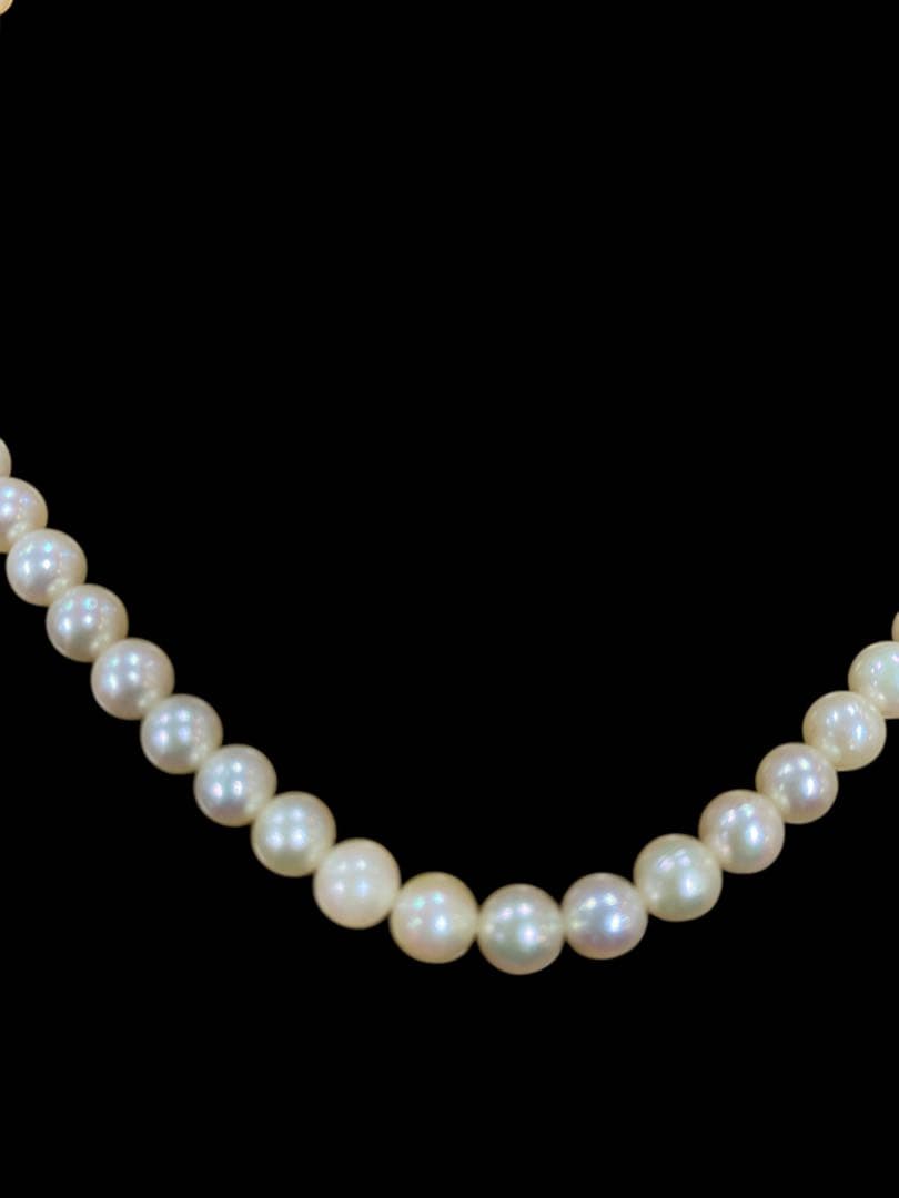 Akoya pearl necklace featuring 5.1mm pearls with silver mark setting on a 41 cm chain