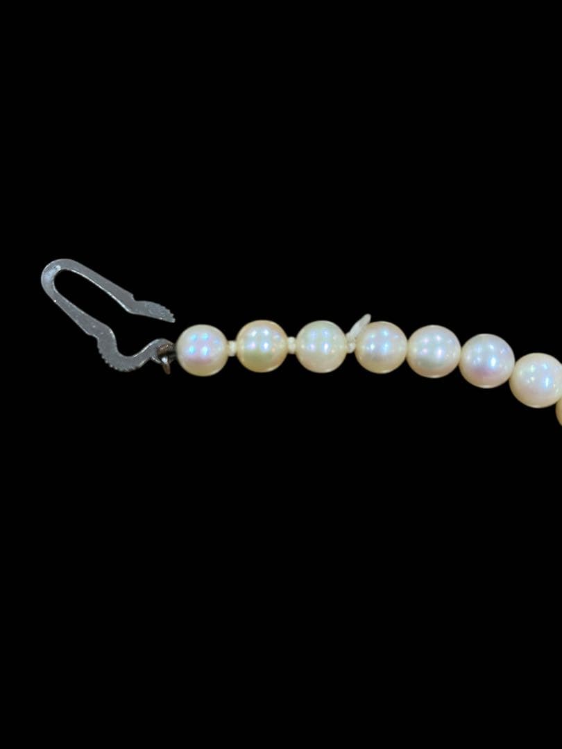 Akoya pearl necklace featuring 5.1mm pearls with silver mark setting on a 41 cm chain
