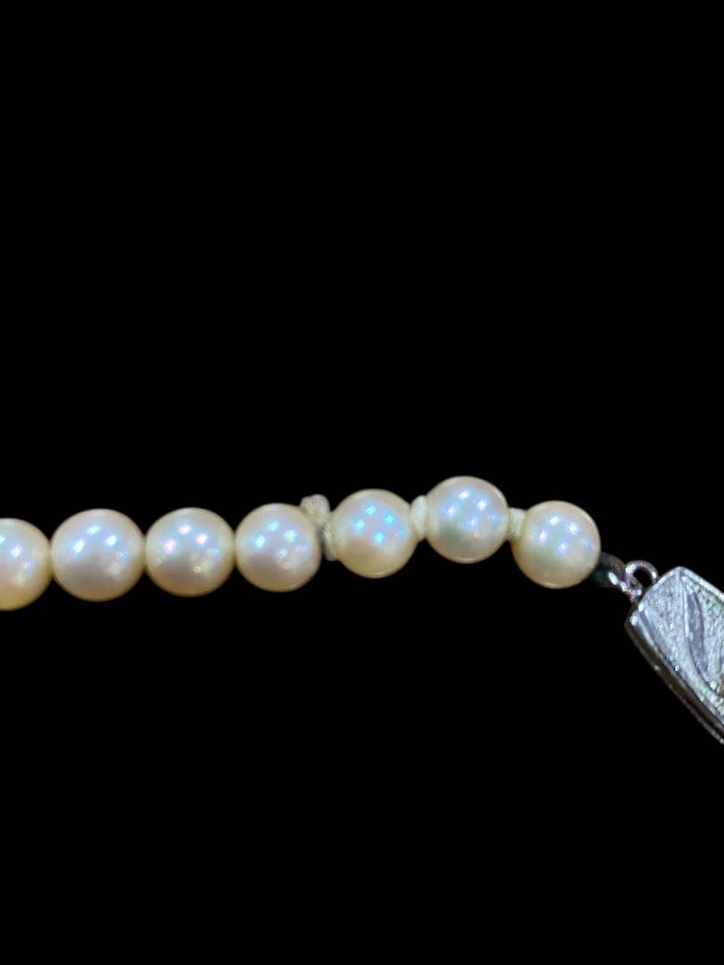 Akoya pearl necklace featuring 5.1mm pearls with silver mark setting on a 41 cm chain