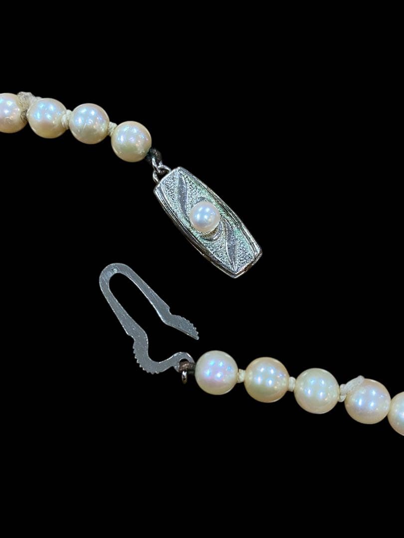 Akoya pearl necklace featuring 5.1mm pearls with silver mark setting on a 41 cm chain