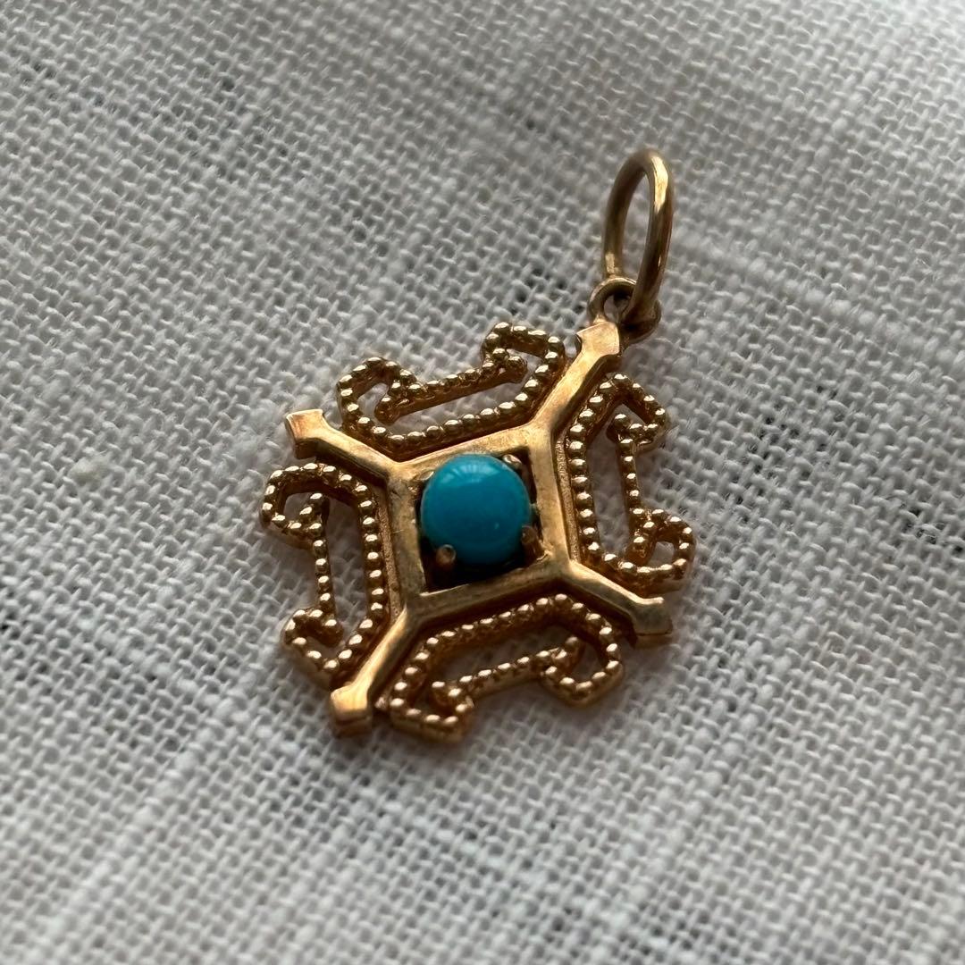 agete K10 gold pendant top with geometric frame and turquoise stone in pink gold tint