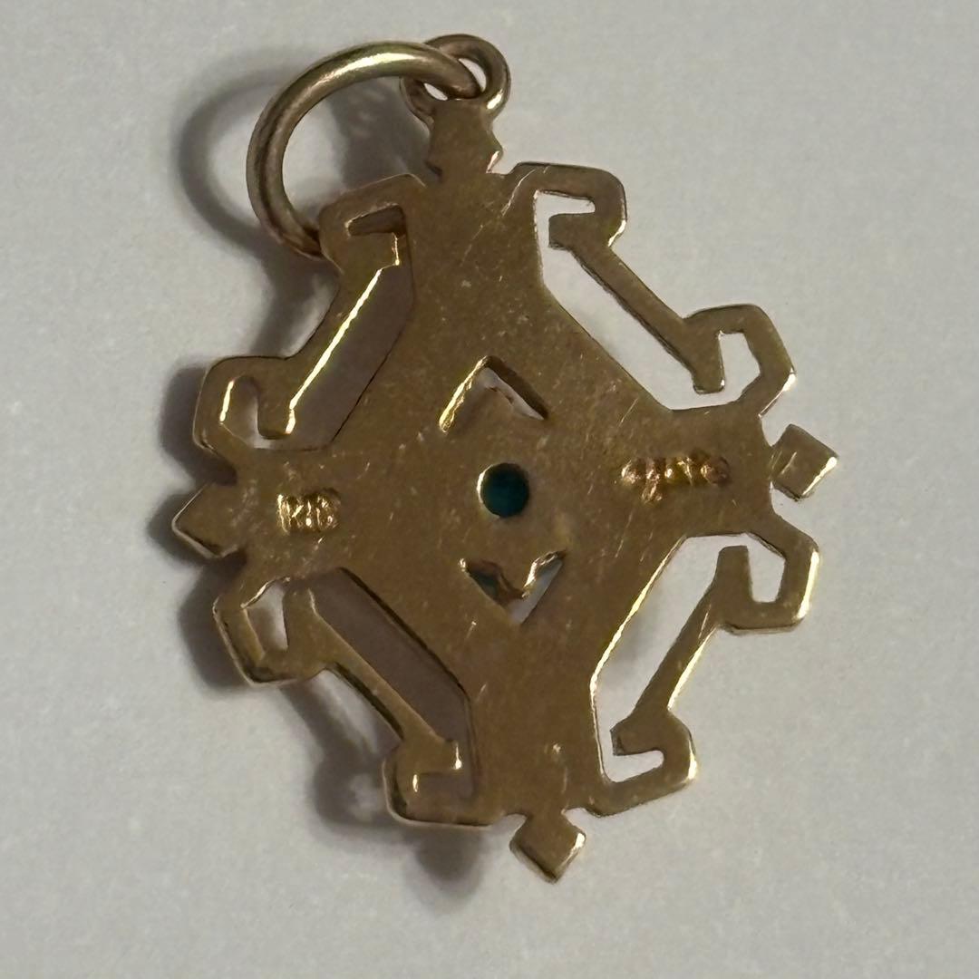 agete K10 gold pendant top with geometric frame and turquoise stone in pink gold tint