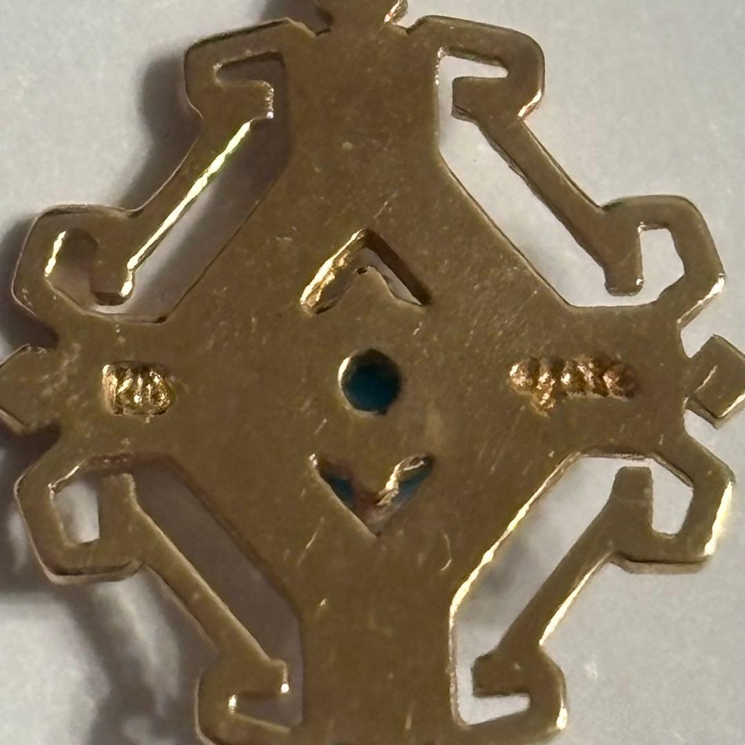 agete K10 gold pendant top with geometric frame and turquoise stone in pink gold tint