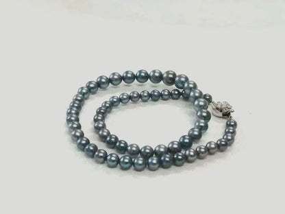 Akoya pearl necklace with blue dyed round pearls sized 9.1-6 mm on a 43.5 cm string with visible luster