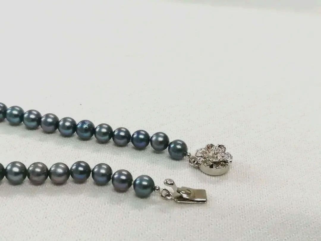 Akoya pearl necklace with blue dyed round pearls sized 9.1-6 mm on a 43.5 cm string with visible luster