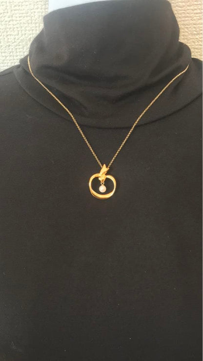 Mikimoto pearl pendant top with a small 2.5mm pearl on a plated setting