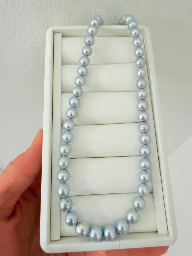 Akoya pearl necklace with 7-8mm ice blue gray semi-baroque pearls showing natural growth marks and gentle shine