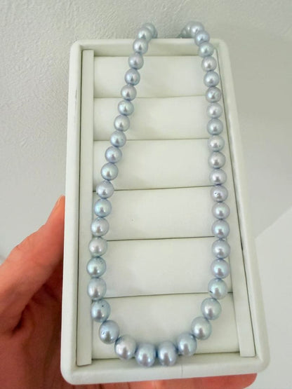 Akoya pearl necklace with 7-8mm ice blue gray semi-baroque pearls showing natural growth marks and gentle shine