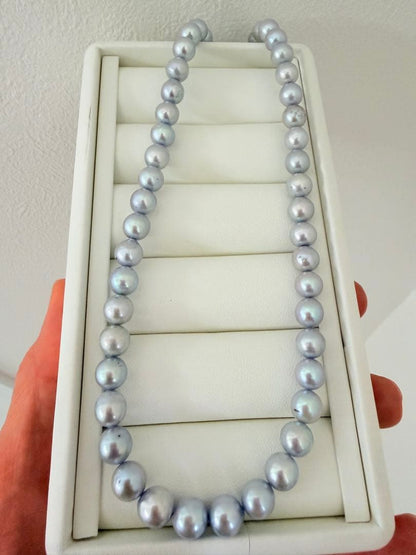 Akoya pearl necklace with 7-8mm ice blue gray semi-baroque pearls showing natural growth marks and gentle shine