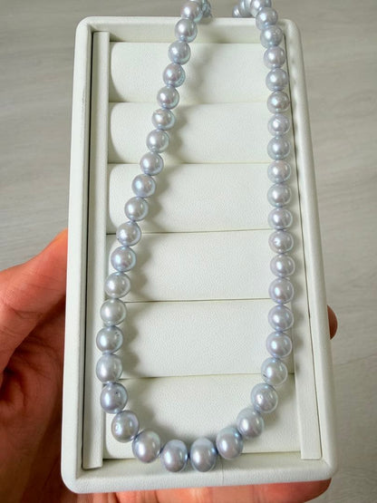 Akoya pearl necklace with 7-8mm ice blue gray semi-baroque pearls showing natural growth marks and gentle shine