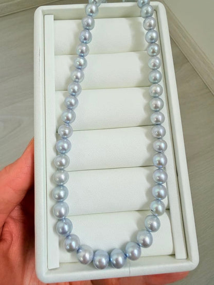 Akoya pearl necklace with 7-8mm ice blue gray semi-baroque pearls showing natural growth marks and gentle shine