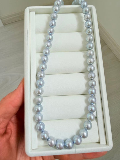 Akoya pearl necklace with 7-8mm ice blue gray semi-baroque pearls showing natural growth marks and gentle shine