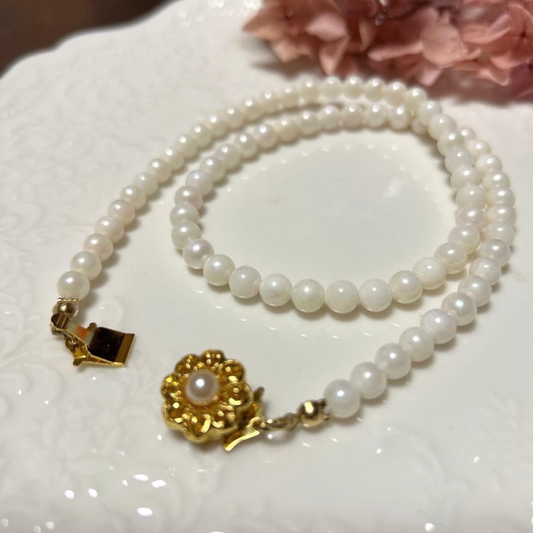Formal Akoya pearl necklace 42 cm with 6 mm round pearls from Japan on a white background