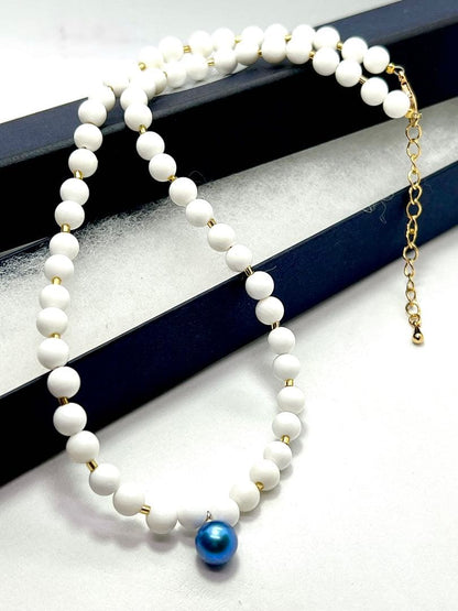 Akoya pearl necklace with black and indigo blue pearls, white onyx beads, and K18 gold leaf Venetian glass parts