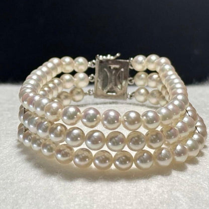 3-strand Akoya pearl bracelet with 5-5.5mm white to light pink pearls and silver clasp