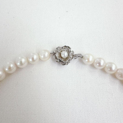Close-up of an Akoya pearl necklace featuring 8-8.5mm white pearls on a 40cm strand