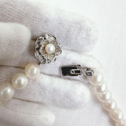 Close-up of an Akoya pearl necklace featuring 8-8.5mm white pearls on a 40cm strand