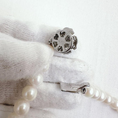 Close-up of an Akoya pearl necklace featuring 8-8.5mm white pearls on a 40cm strand