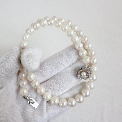 Close-up of an Akoya pearl necklace featuring 8-8.5mm white pearls on a 40cm strand